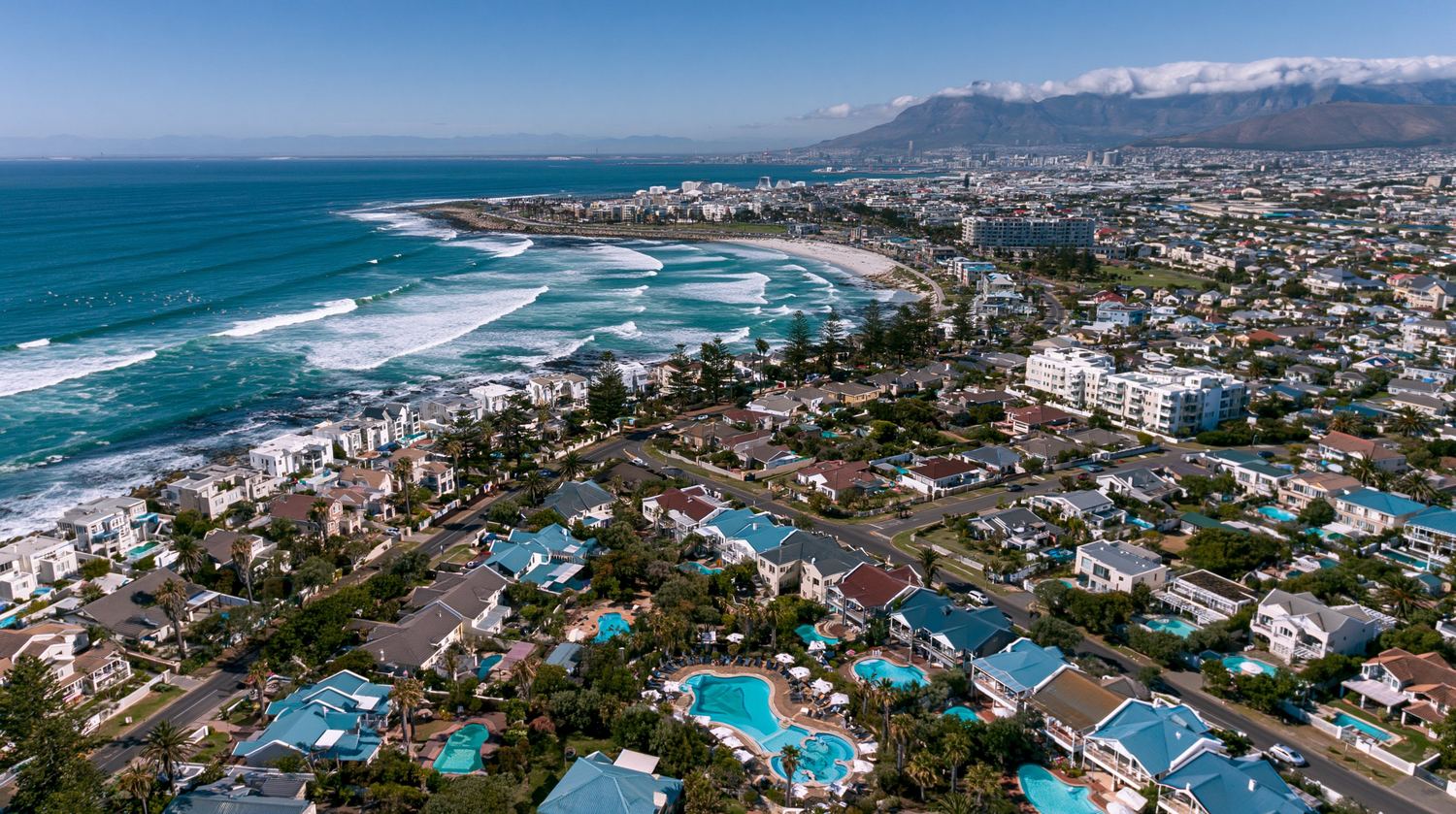 Aerial view of a sunny coastal neighborhood near Cape Town